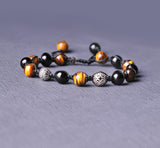 Stunner stitch Bracelet with pure onyx and tiger eye stones.