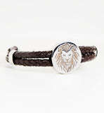 Iconic silver lion logo with genuine leather.