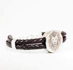 Iconic silver lion logo with genuine leather.