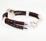 Iconic silver lion logo with genuine leather.
