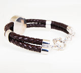 Iconic silver lion logo with genuine leather.