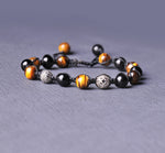 Stunner stitch Bracelet with pure onyx and tiger eye stones.