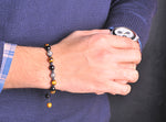 Stunner stitch Bracelet with pure onyx and tiger eye stones.