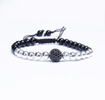 Silver balls with zircon center piece.