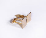 Gold cufflink with zircon stones.