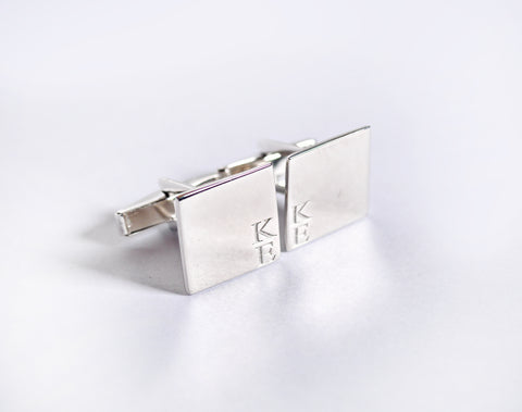 Silver cufflink with signature letters